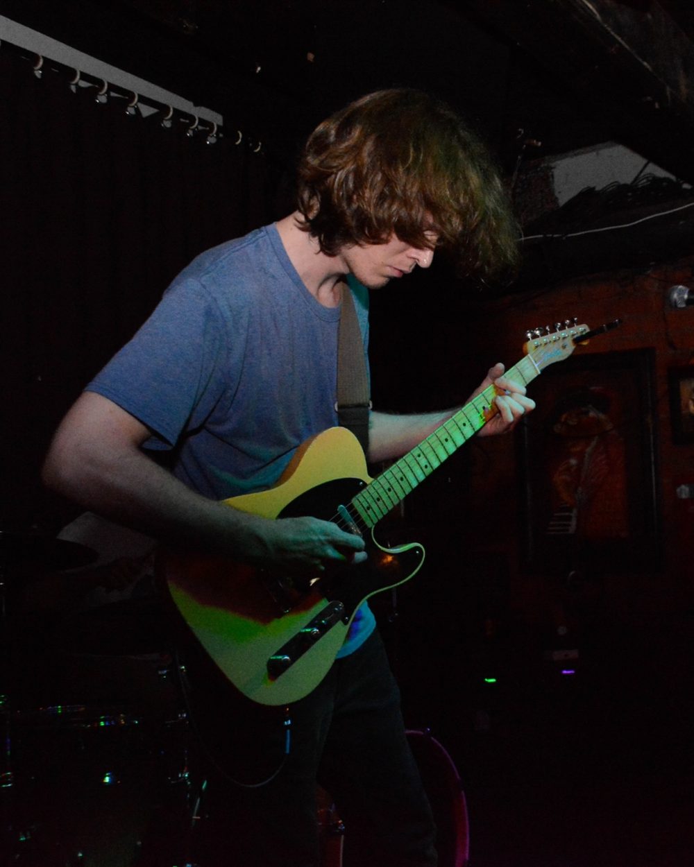 Blake Wolf playing guitar at a live show